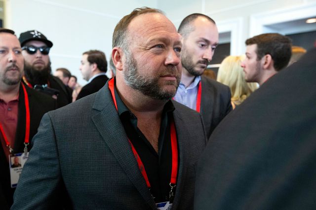 Conspiracy theorist Alex Jones walks at the Conservative Political Action Conference, CPAC 2020, at the National Harbor, in Oxon Hill, Md.